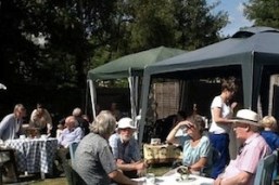 People enjoying a sunny garden party